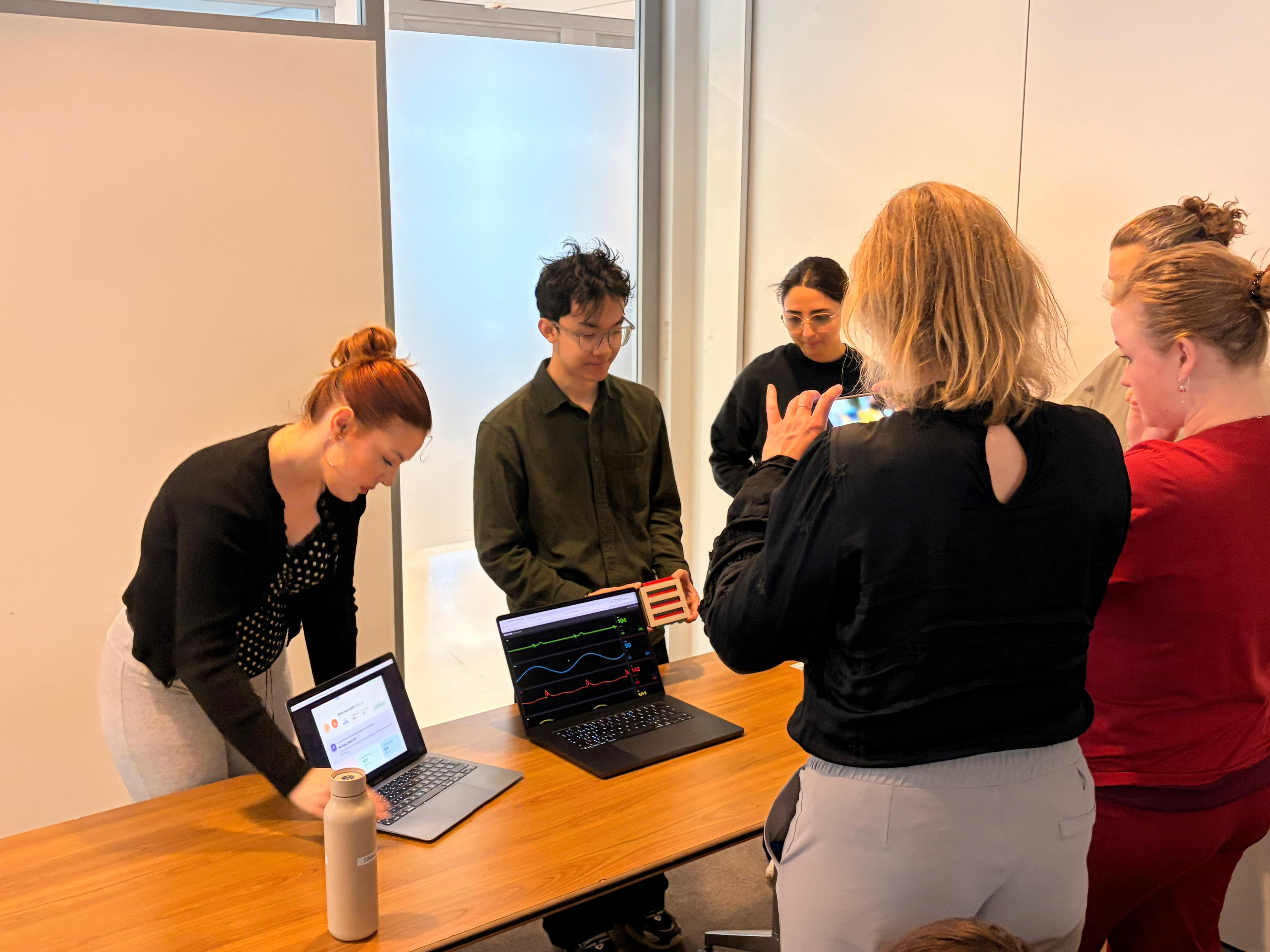 The team running a Wizard-of-Oz test with nurses around the bedside reminder and monitor.