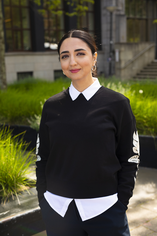 Negin Bokaei standing outdoors, smiling.